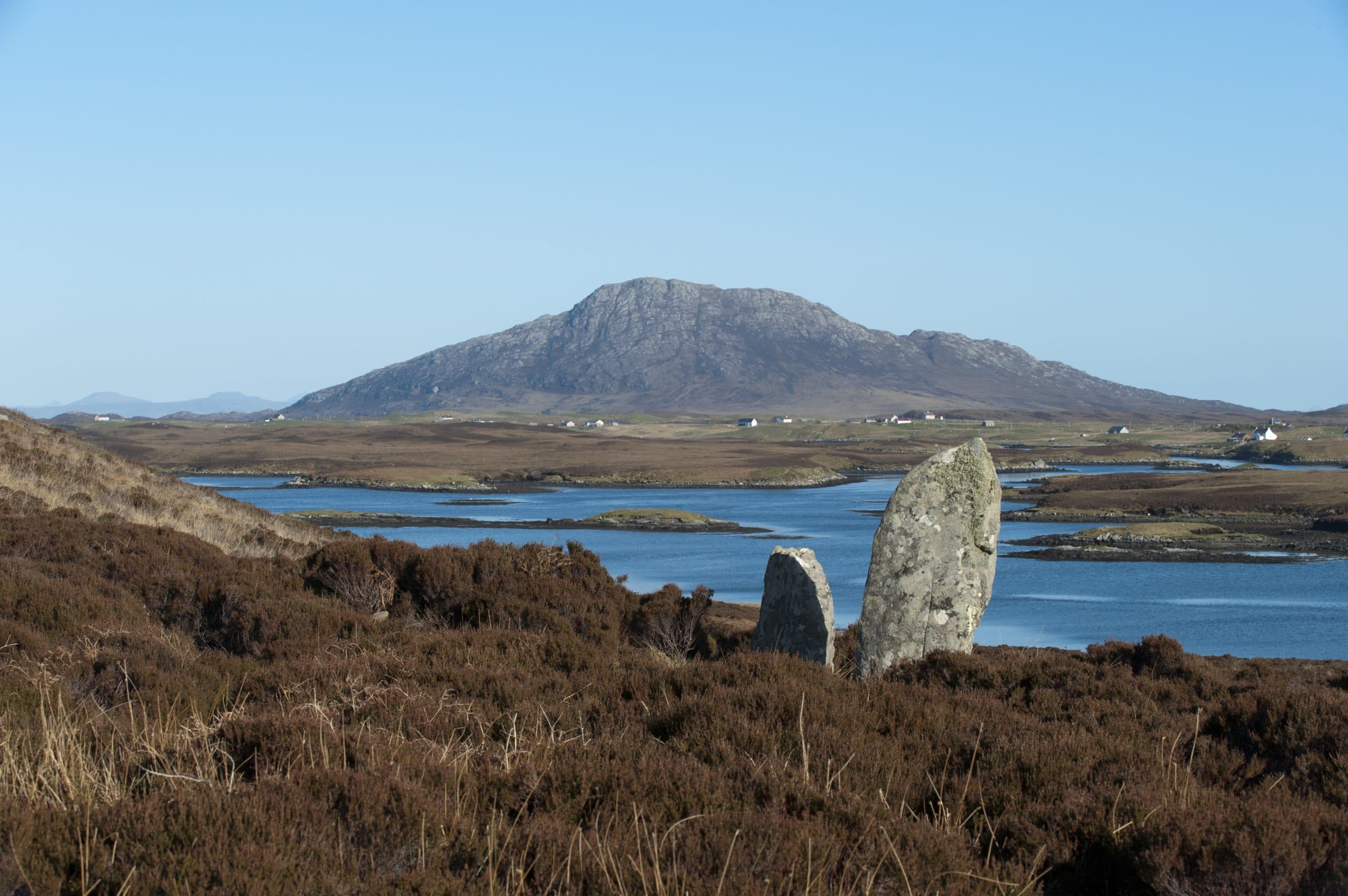 Standing stones on the North Uist moor, with a loch and hill beyond